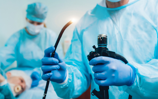 Medical team preparing endoscopy equipment for a patient during a safe endoscopic procedure